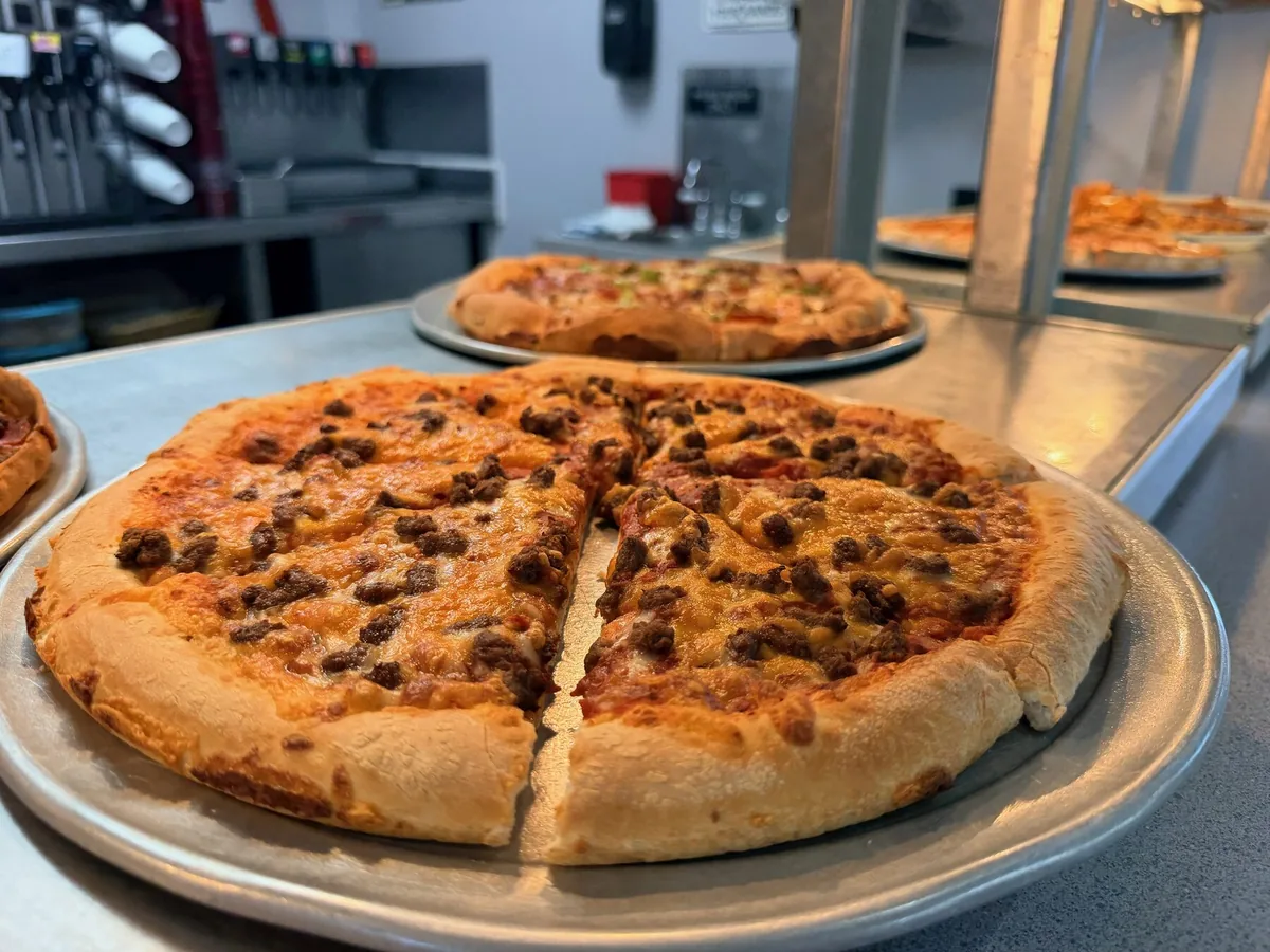 A fresh sausage pizza at Ken's Pizza